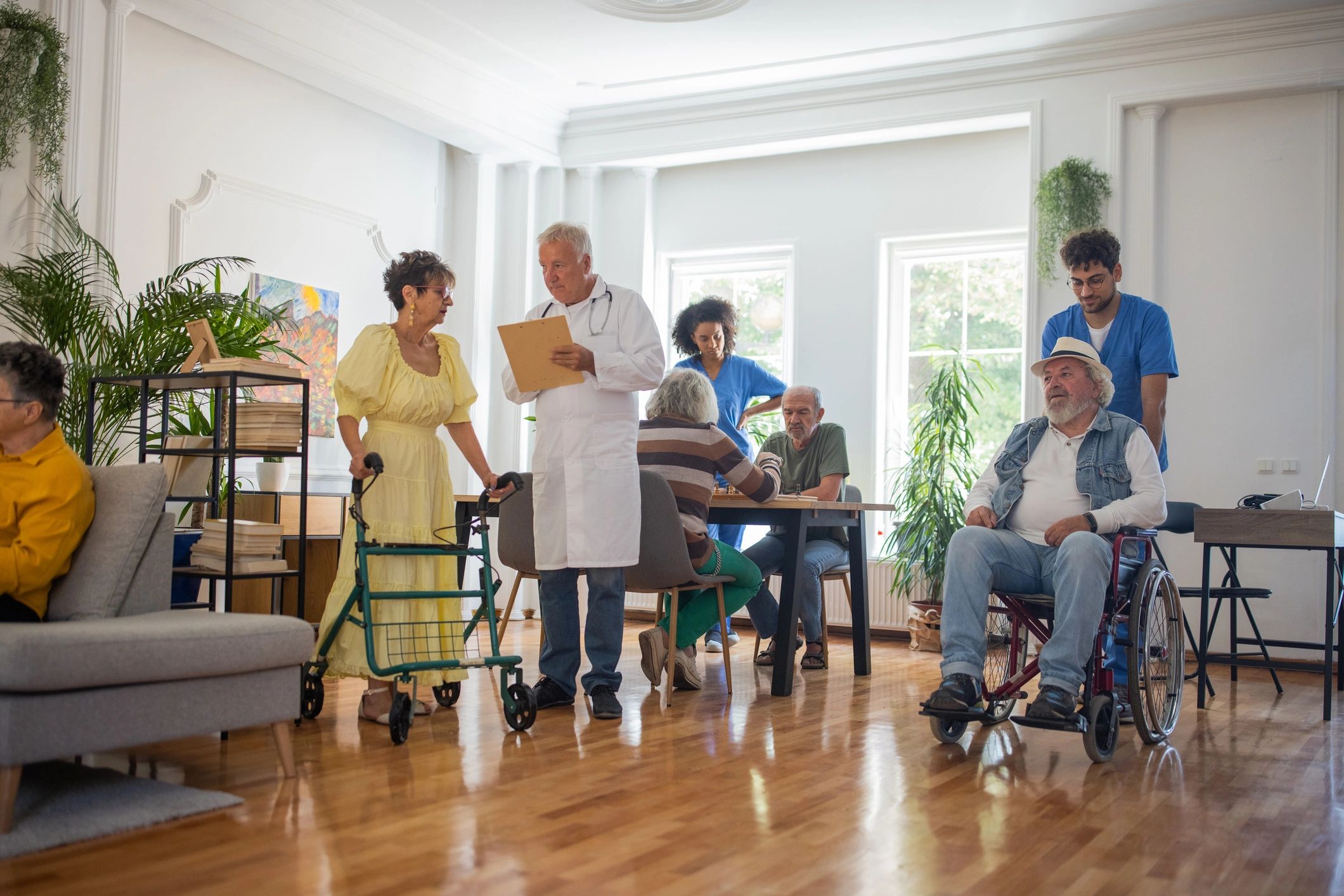 Senior people and healthcare workers in nursing home